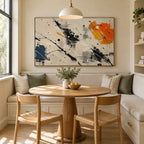 Abstract Expressionist abstract oil painting showing pale abstract field with black, blue and orange marks in a black and white palette, contemporary wall art.